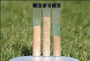 Three clear cylinders filled with sand at varying densities, demonstrating compaction comparison.