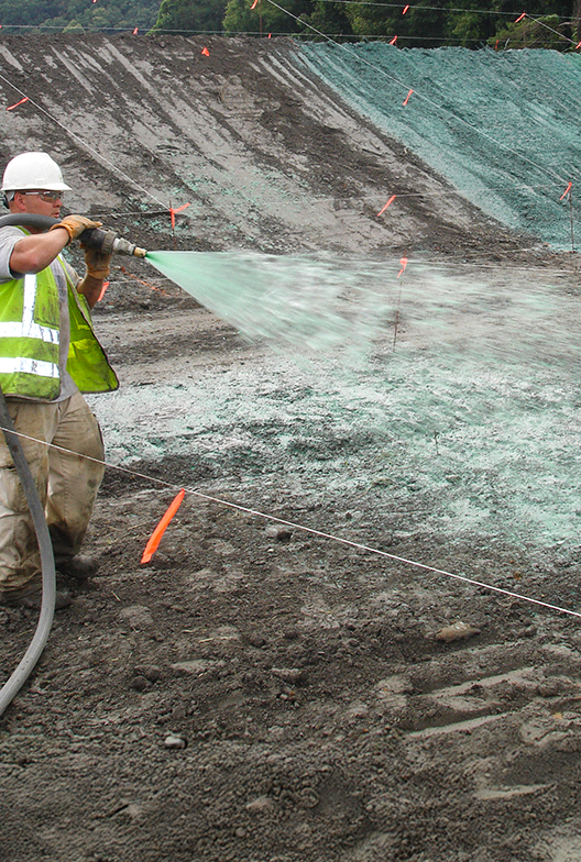 Technician applying ground product.