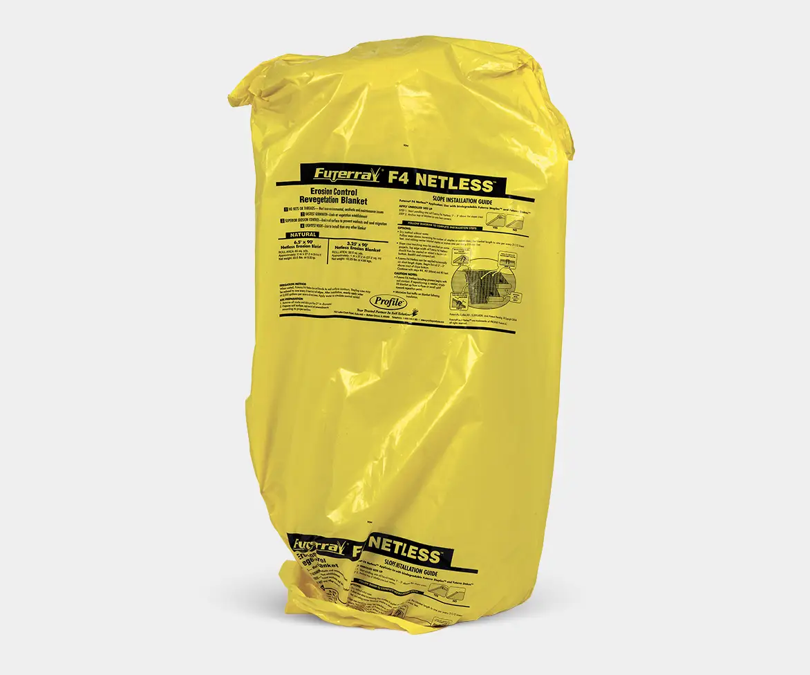 Yellow plastic-wrapped package labeled “Futerra F4 Netless Erosion Control Revegetation Blanket” with installation instructions printed on the front.