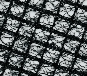 Close-up texture of black turf reinforcement mesh with interwoven strands forming a durable grid pattern.