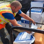 Crew loading Hydro Blanket bags.