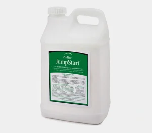 A white plastic container with a handle and a green label reading ProPlus JumpStart, used for growing grass, turf, and sod.