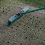 Raking Profile Porous Ceramic into golf green