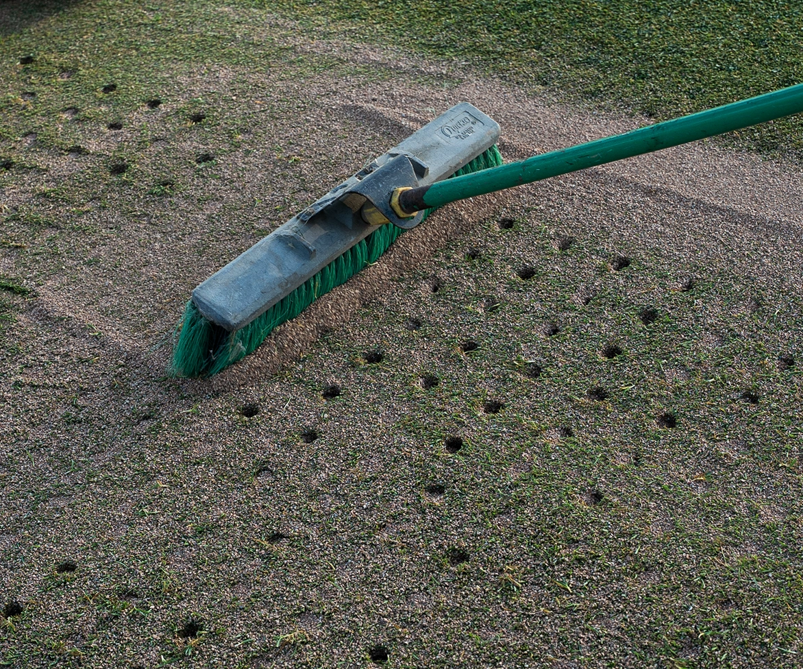 Raking Profile Porous Ceramic into golf green