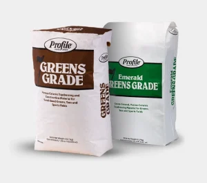 Two bags of Profile porous ceramic topdressing labeled “GREENS GRADE” (brown panel) and “Emerald GREENS GRADE” (green panel) displayed side by side on a white background.