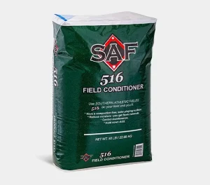 A 50 lb bag of SAF 516 Field Conditioner in green packaging, labeled for use on athletic fields to improve soil conditions and reduce compaction.