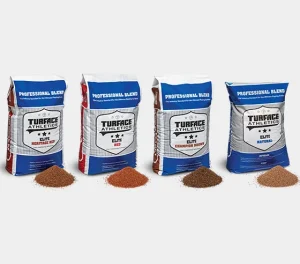 Four bags of Turface Athletics soil products, each with a small pile of differently colored soil in front, labeled Heritage Red, Red, Champion Brown, and Natural.