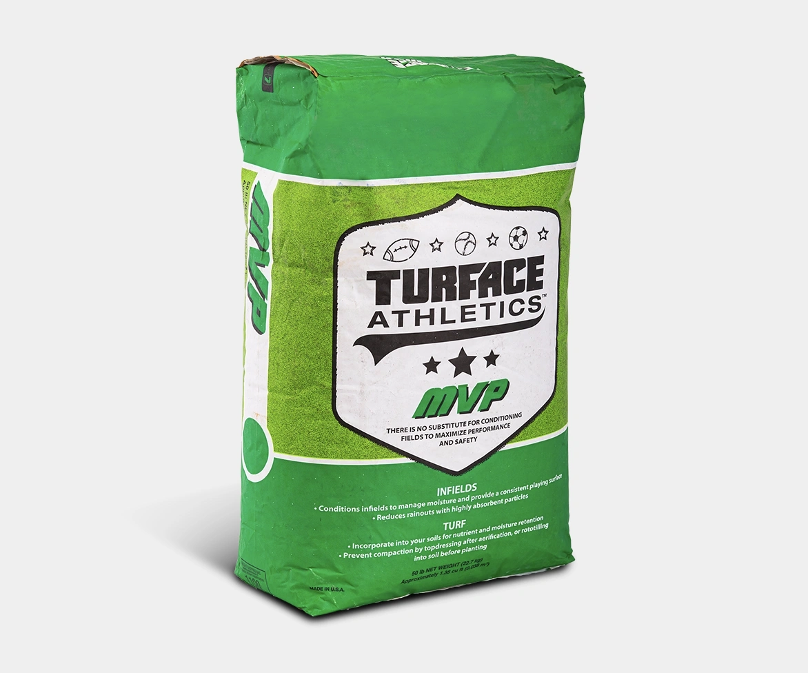 A green bag labeled Turface Athletics MVP, featuring white and black text and sports icons, stands upright against a white background. The bag is used for athletic field conditioning.