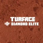 Red infield dirt with the white text Turface SAF Diamond Elite centered on top. The background shows a textured, loose soil surface, suggesting a baseball or softball field product.