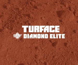 Red infield dirt with the white text Turface SAF Diamond Elite centered on top. The background shows a textured, loose soil surface, suggesting a baseball or softball field product.