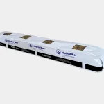 A long, rectangular white bag labeled HydraFiber Hydroponic Media with visible brown growing medium inside and black and blue branding on the packaging.