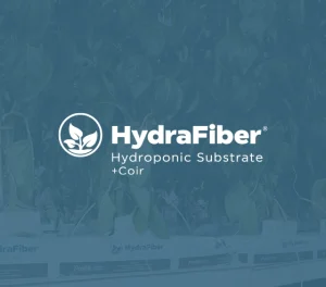 HydraFiber logo with Hydroponic Substrate + Coir text over a background of green plants growing in a hydroponic system.