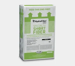 A white and green bag labeled HydraFiber Ultra Specialty Short Fiber with the text Feed This End First at the top, on a plain light background. The bag has instructions and product details printed on the front.