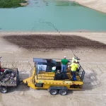 ProOrganics being applied near water.