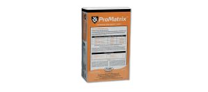 A rectangular orange and white box labeled ProMatrix stands upright with text, tables, and the Profila logo visible on the front and side panels.