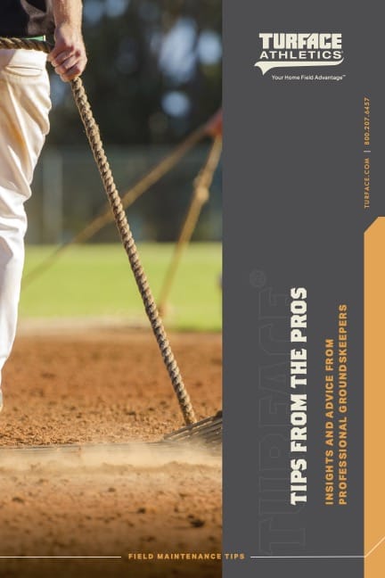 A person smooths a baseball field with a rake; the image promotes Turf Athletics and offers Tips from the Pros for field maintenance from professional groundskeepers.