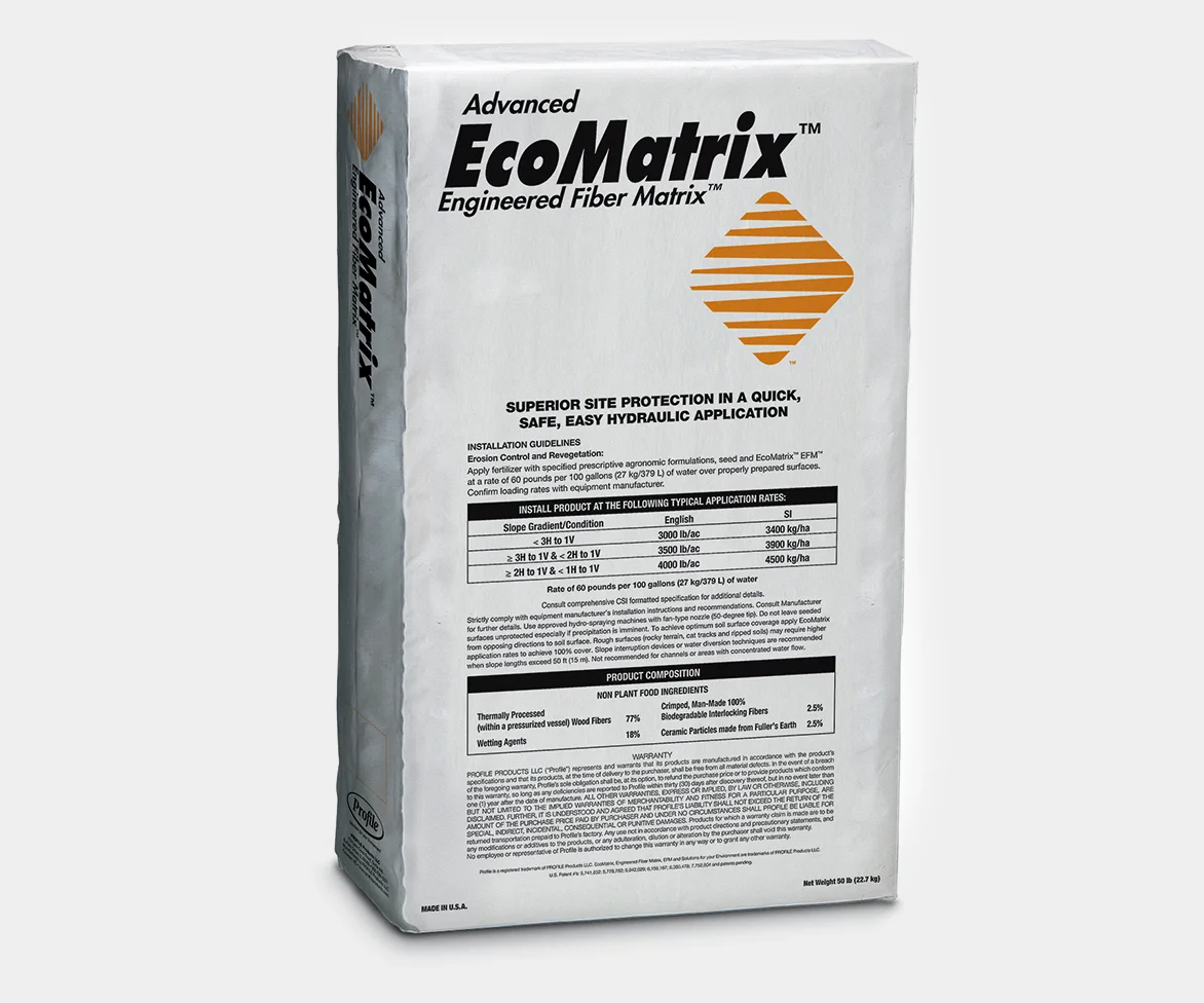 White bag of Advanced EcoMatrix Engineered Fiber Matrix with a gold logo and printed product information, including installation guidelines, application rates, product composition, and warranty details. Net weight: 50 lb (22.7 kg). Made in U.S.A.